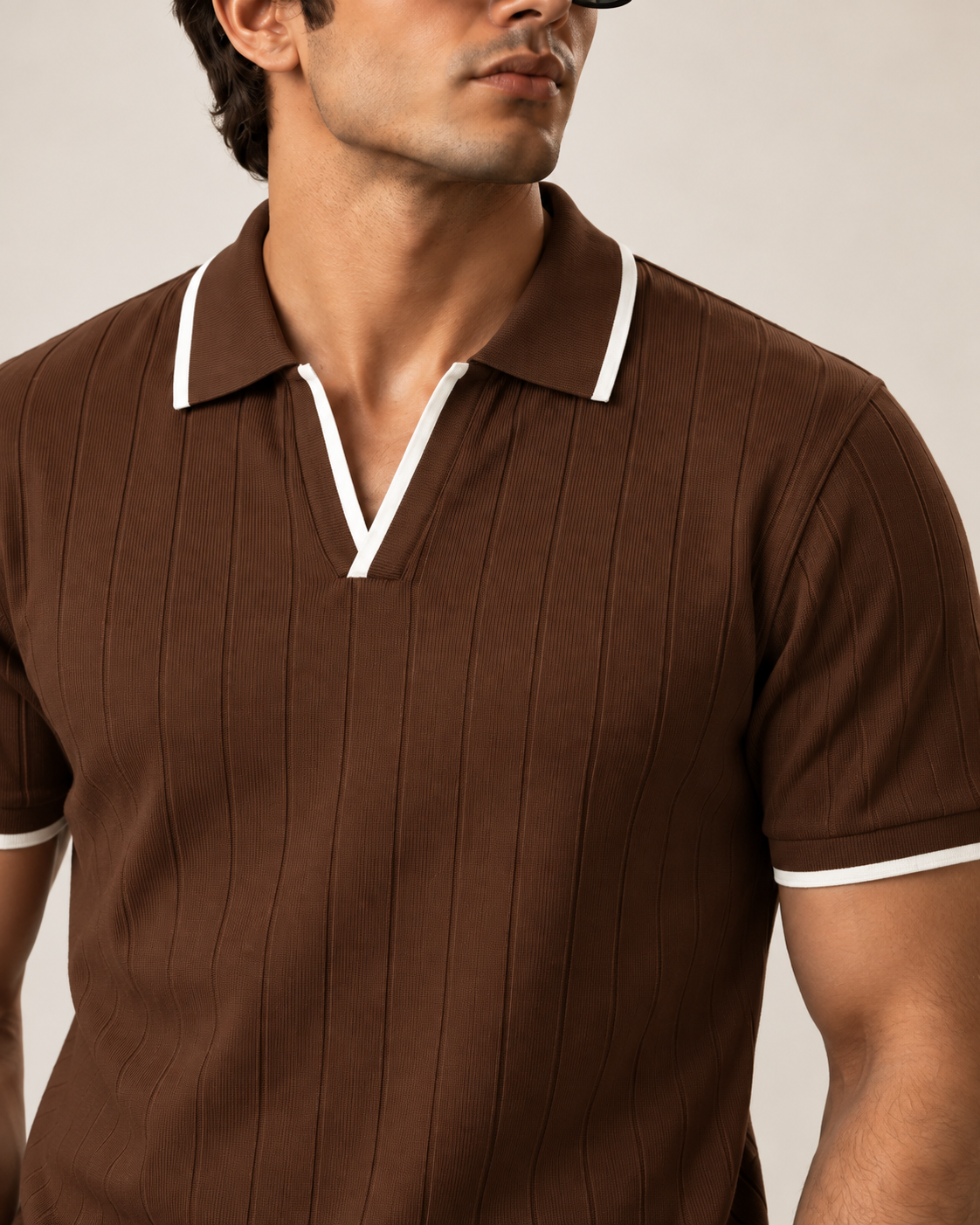 Brown drop needle polo open V neckline and white contrast tipping — detail