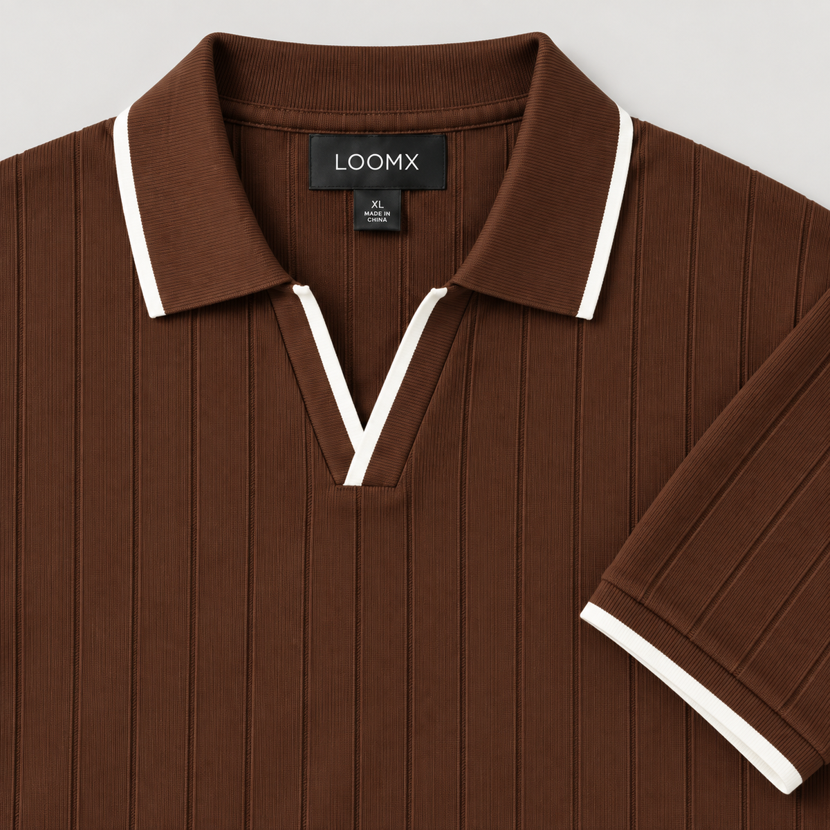 Brown drop needle polo open V neckline and white contrast tipping — detail
