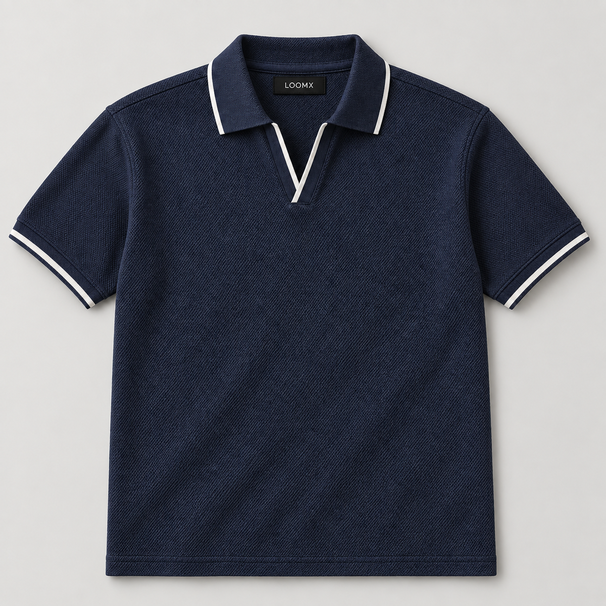 LOOMX Navy Piqué Polo with white contrast tipping — front flat lay